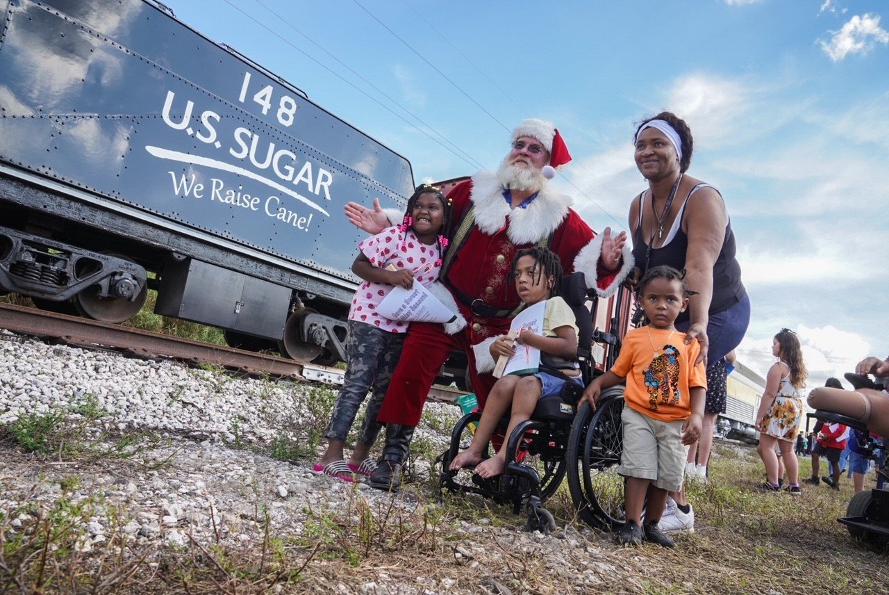 Children meet Santa Dec. 11 during U.S. Sugar's Santa Express event in partnership with Toys for Tots.
